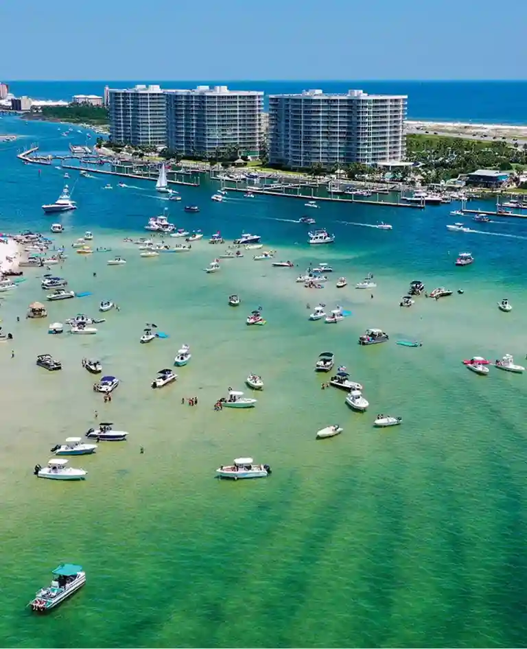 a beach with boats in the water