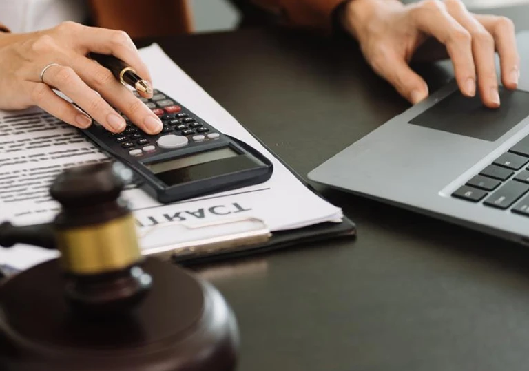a lawyer working on a laptop