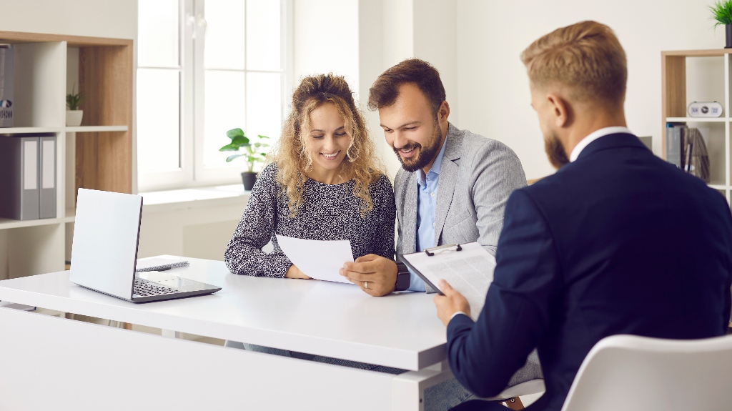 happy couple is consulting with lawyer