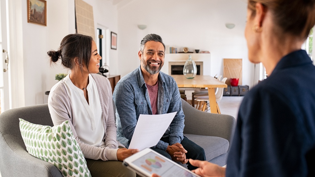 happy couple is consulting with lawyer